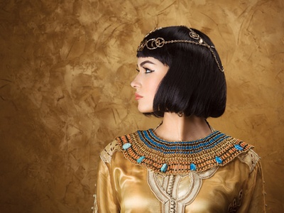 woman made up and dressed like Cleopatra