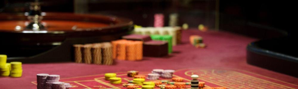 view of roulette table full of chips being bet on different numbers